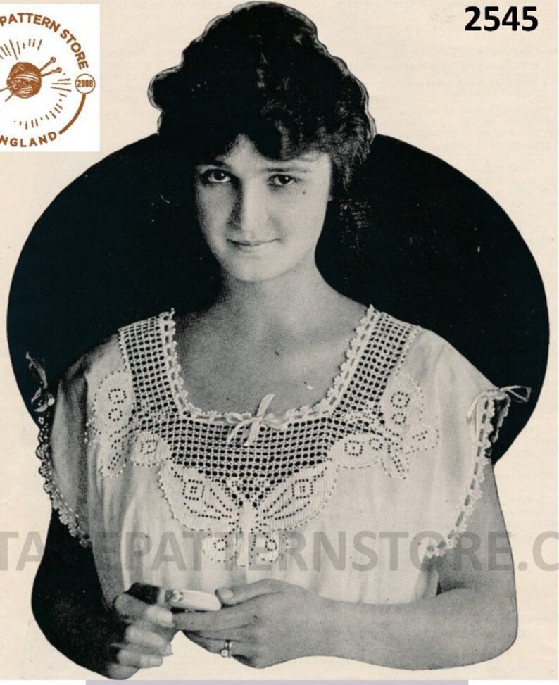 May include: A vintage black and white photo of a woman wearing a white crochet top with a butterfly design. The photo is from a pattern store and has the number 2545 printed on it.