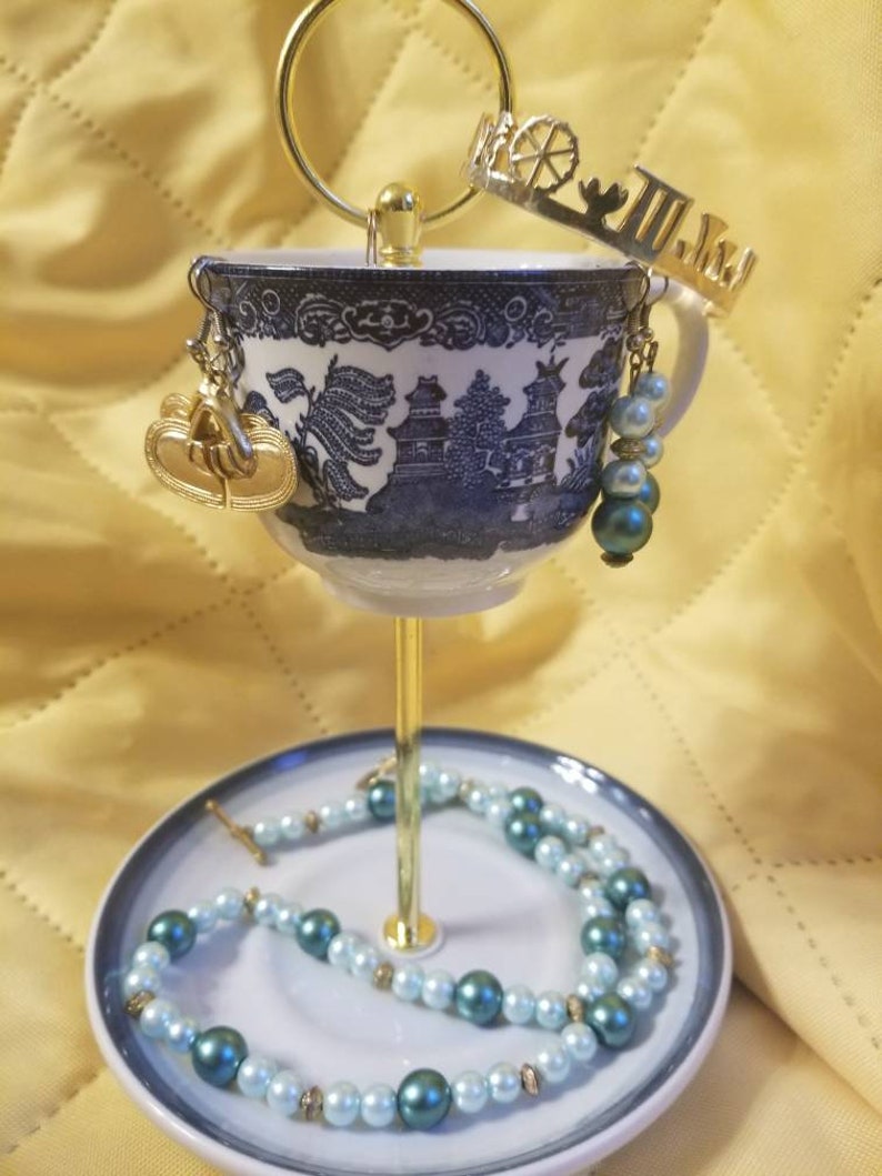 Blue willow tea cup jewelry stand