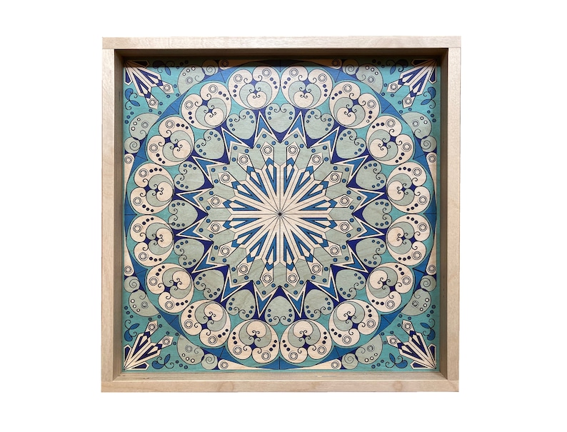 May include: A wooden tray with a blue and white mandala design. The tray is square and has a light wood frame.