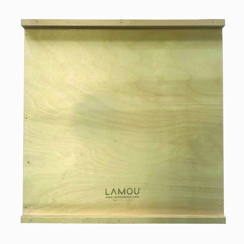 May include: A plain, light brown wooden board with a logo that reads "LAMOU'" and the website "www.lamoudesign.com". The logo is printed in black and the website is printed in a smaller font size.