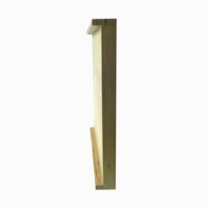 May include: Side view of a wooden frame with a light wood finish. The frame is made of plywood and has a simple, rectangular shape.