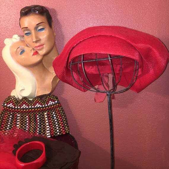 Vintage 1930s red straw hat with faded ribbon