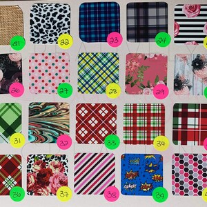 May include: A collection of 40 different patterned fabric swatches. The swatches are arranged in a grid of 5 rows and 8 columns. The patterns include plaid, polka dots, stripes, floral, and abstract designs. The swatches are all different colors, including red, green, blue, pink, and black.