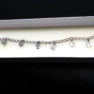Charm Bracelet All Sterling Silver With Dangling Letters Spelling Out The Word Mother. #82