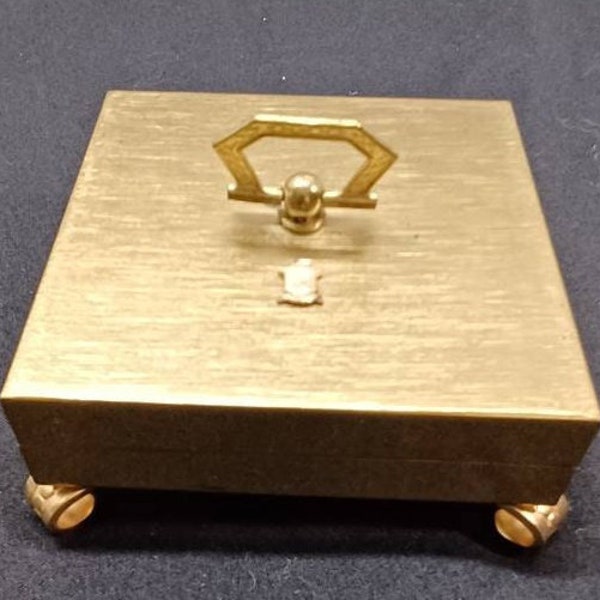Brassy Vintage Footed Trinket Box With Small Handle And Emblem On The Lid.  #166