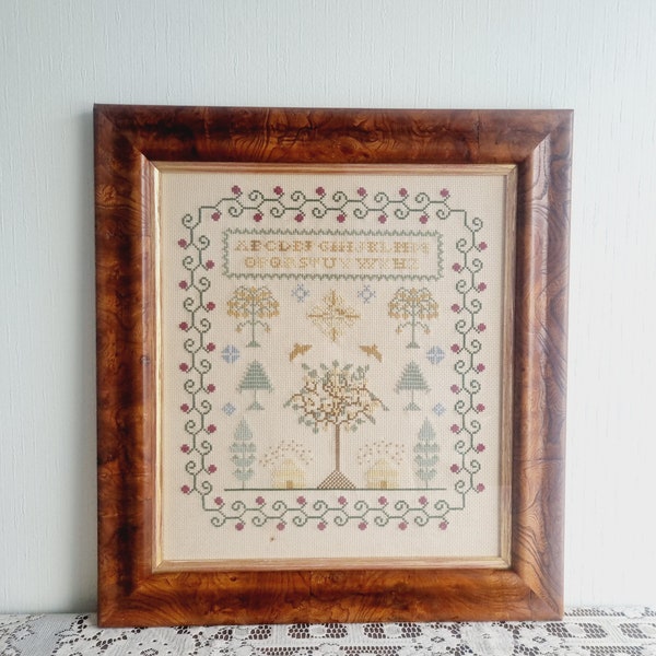 Vintage needlework alphabet sampler in frame