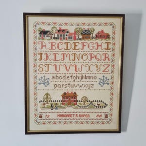 Large vintage needlework alphabet sampler in frame 1988