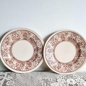 Antique pair of plates in the aesthetic movement style late 1800s
