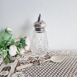 Antique Birmingham silver and crystal sugar shaker