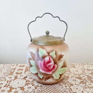 Large antique ceramic floral biscuit barrel/storage jar with silverplate lid
