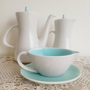 Poole pottery twin tone gravy jug with drip plate, ice green and Seagull