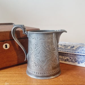 Antique pewter jug engraved with monogram