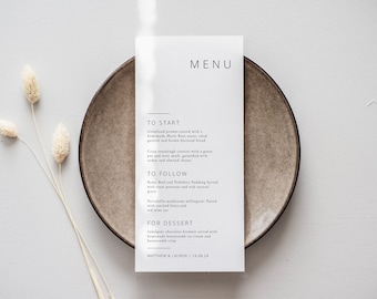 May include: A white wedding menu card with black text. The menu includes a three-course meal: Greenland prawns, Roast Beef and Yorkshire Pudding, and Indulgent chocolate brownie. The card also includes the date "14.08.24" and the names "Matthew & Lauren".