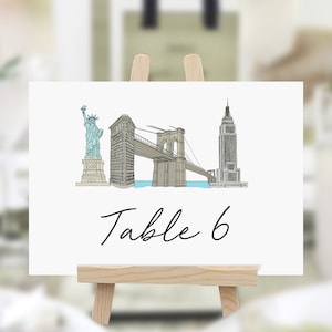 Nomes para mesas de casamento em Nova York, números de mesa temáticos de Nova York, cartões de nomes de mesa ilustrados em Nova York, cartões com números de mesa em Nova York