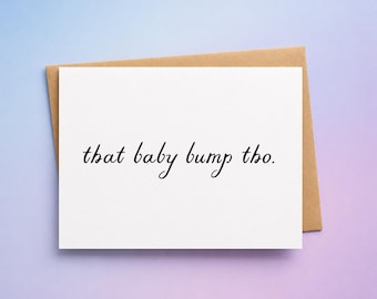 May include: A white greeting card with the phrase "that baby bump tho." in black script. The card is inside a brown envelope, set against a gradient background of purple and blue.