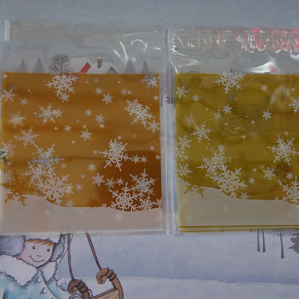 100 Sachets transparents étoiles et flocons  dorés- Noel