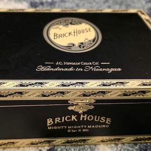 Brick House Mighty Mighty Maduro empty wooden cigar box with metal hinges and clasp.