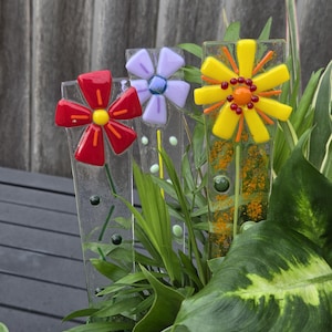 May include: A set of three ceramic mugs with a speckled, matte finish. The mugs are in shades of cream, light gray, and dark gray. Each mug has a simple, minimalist design, perfect for coffee or tea.