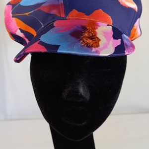 Blue with multi coloured floral baker boy style hat.  Upcycled