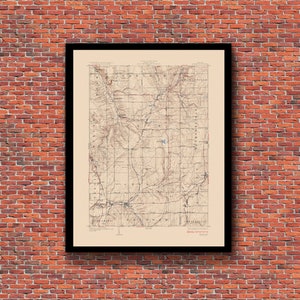 May include: A vintage topographic map of the area around the town of Eldorado, Kansas. The map is printed on cream-colored paper and shows the terrain, roads, and rivers of the area. The map is framed in a black frame.