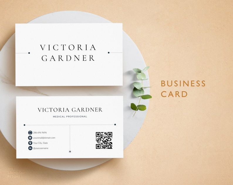 May include: A white business card with black text for Victoria Gardner, a medical professional. The card includes contact information, a QR code, and the text "THE STAND OUT RESUME".