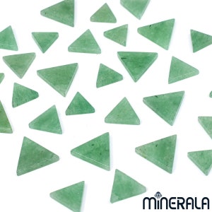 May include: A collection of 25 green triangle-shaped gemstone chips. The chips are smooth and polished, with a light green colour.