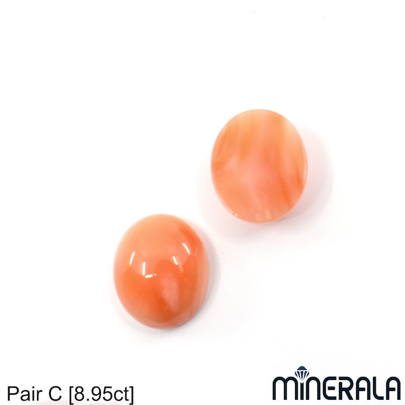 May include: Pair of round, peach-colored coral cabochons, each measuring approximately 1 cm in diameter.  Pair C [8.95ct]
