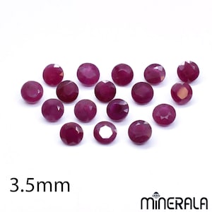 May include: A collection of fifteen round, faceted, deep pinkish-red rubies, each measuring 3.5mm in diameter. The gemstones are arranged in a loose cluster, displaying a brilliant cut with multiple facets that reflect light across their surfaces.
