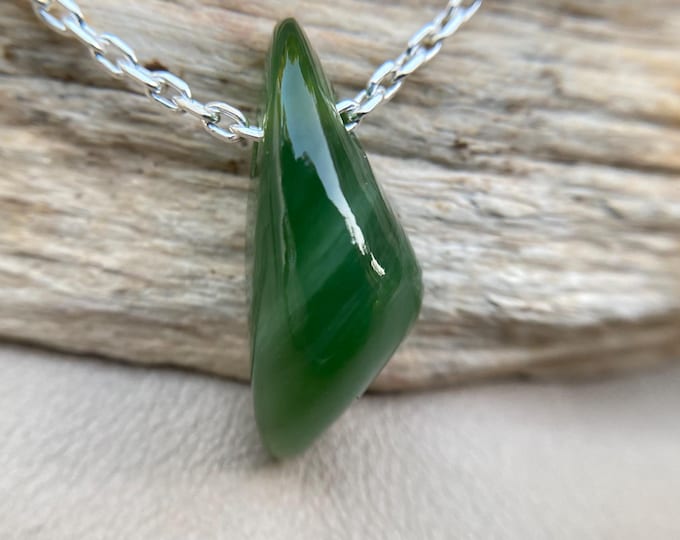 Unique pendant crafted from stunning chatoyant nephrite — a truly one-of-a-kind piece for collectors and jewelry lovers.