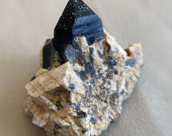 Morion crystals on spar