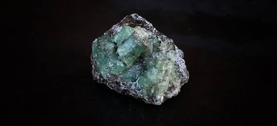 Emerald crystals on rock