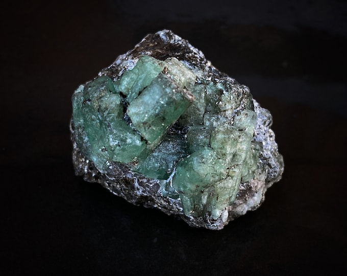Emerald crystals on rock
