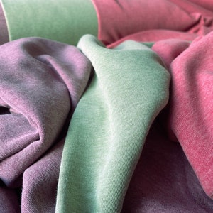 Felpa tinta unita rosso-verde lime screziato viola-screziato, tessuto per felpa in diversi colori, selezione di colori, tessuto accogliente, tessuti per moda maglione