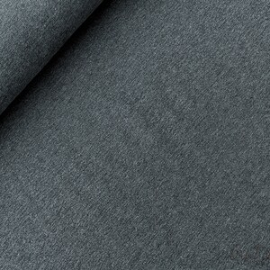 May include: Close-up of a dark gray textured fabric. The fabric has a soft, fuzzy feel and a slightly mottled appearance.