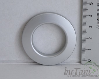 May include: A silver metal curtain ring with a 2-inch diameter.