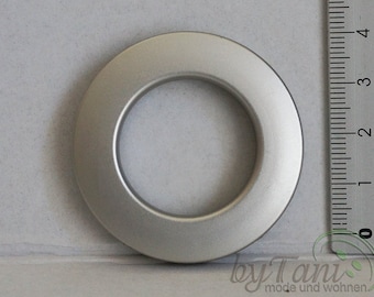 May include: A silver metal grommet with a 40mm inner diameter. The grommet is a ring-shaped piece of metal used to reinforce holes in fabric.