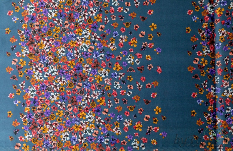 May include: Teal fabric with a scattered floral pattern. The flowers are in shades of pink, purple, orange, and white.