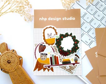 Juego de pegatinas de vinilo impermeables "Cozy Holiday" de Nhp Design Studio para diarios, álbumes de recortes, agendas y portátiles (20 piezas).