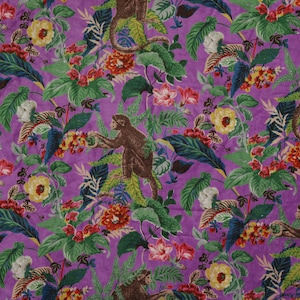 May include: Purple fabric with a repeating pattern of monkeys, flowers, and leaves. The monkeys are brown and are climbing on the leaves. The flowers are pink, red, yellow, and white.