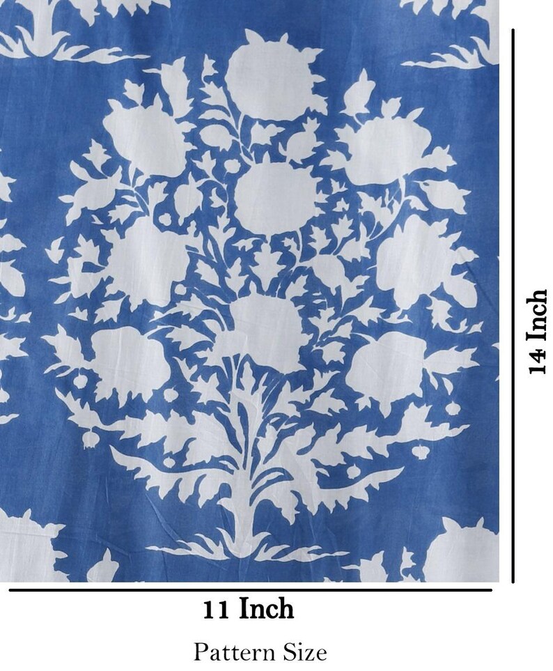 May include: A blue and white floral fabric with a repeating pattern of white flowers and leaves on a blue background. The fabric measures 11 inches by 14 inches.