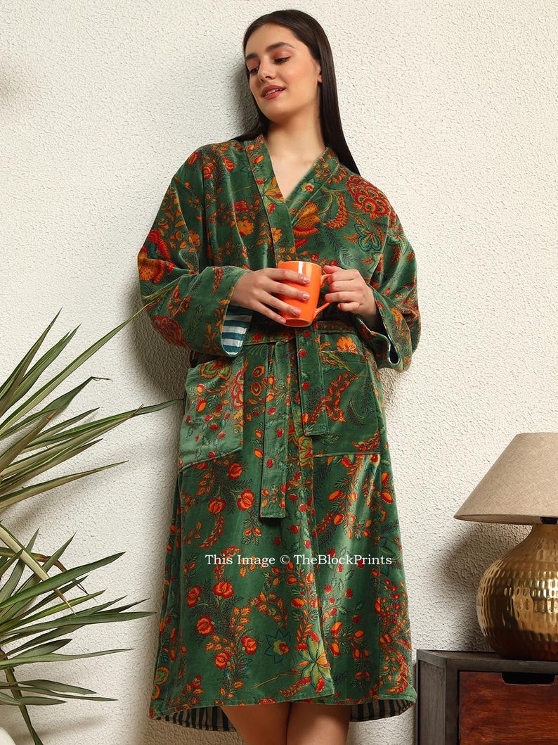 May include: A green velvet robe with a floral print and a matching sash. The robe has a V-neck and long sleeves. This image &copy; TheBlockPrints