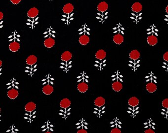 May include: Black fabric with a repeating pattern of red flowers with white stems and leaves.