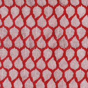May include: A red background with a repeating pattern of white leaf shapes.