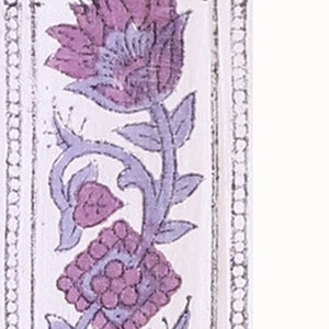 May include: A close-up of a 2-inch wide floral border with a repeating pattern of purple flowers and leaves on a white background. The border is outlined with a black and white dotted line.