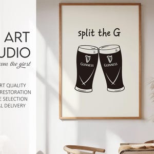 May include: A framed print featuring two black Guinness pint glasses with the text "split the G". The print also includes the text "KG ART STUDIO" and other text.