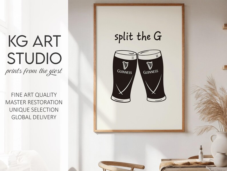 May include: A framed print featuring two black Guinness pint glasses with the text "split the G". The print also includes the text "KG ART STUDIO" and other text.