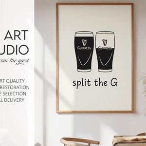 May include: A framed print featuring two black and white Guinness pint glasses with the text "split the G". The print also includes the text "KG ART STUDIO" and other text.