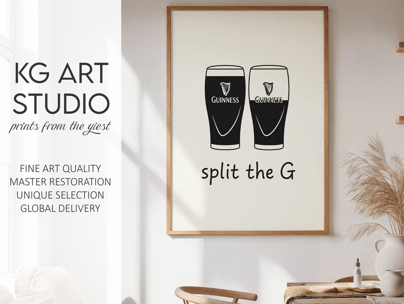 May include: A framed print featuring two black and white Guinness pint glasses with the text "split the G". The print also includes the text "KG ART STUDIO" and other text.