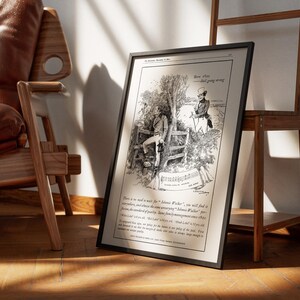 May include: Framed black and white print of a vintage advertisement. The illustration depicts two men in a pastoral setting, with text at the top and bottom. The print is leaning against a wooden easel and a leather chair.