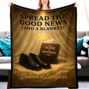 May include: A brown blanket with the text "SPREAD THE GOOD NEWS (AND A BLANKET)" and "Believe in Laughter". The blanket features an illustration of a book, a pair of shoes, and a halo.